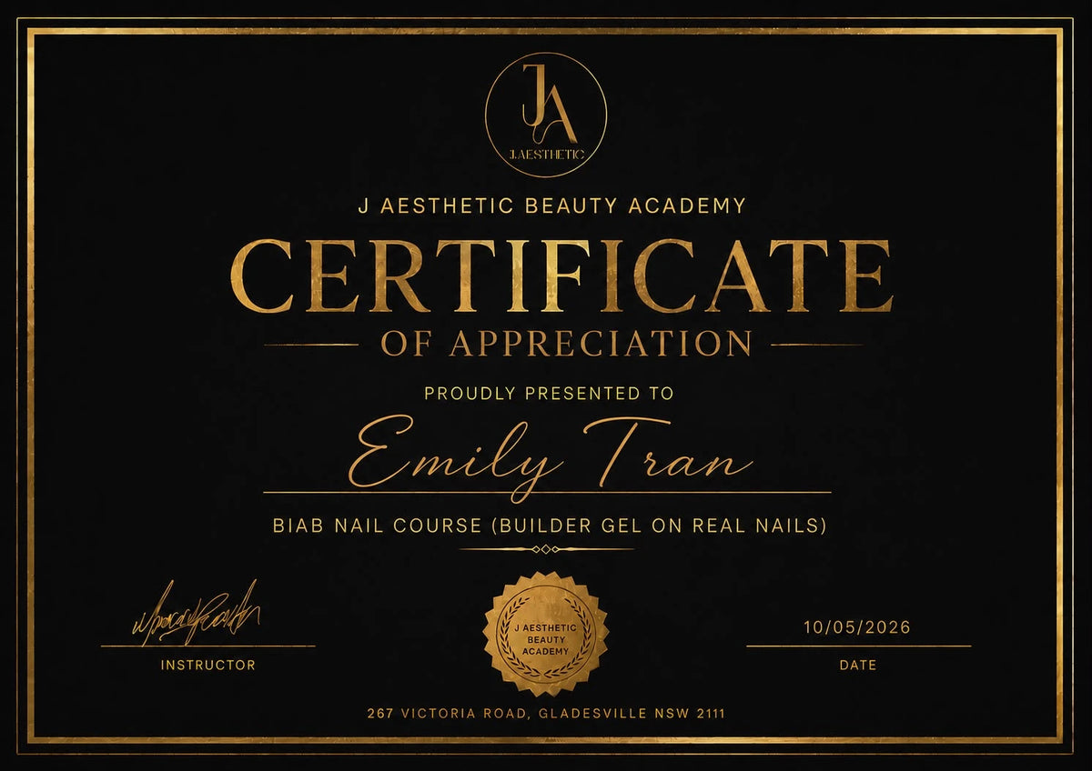 A black certificate of appreciation with elegant gold lettering and border details, presented to Emily Tran for a biab nail course at J Aesthetic Beauty Academy.