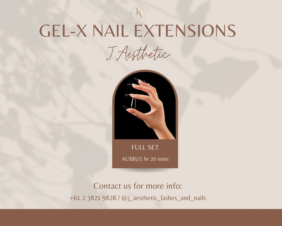 Hand with long square Gel-X nail extensions in a natural nude finish