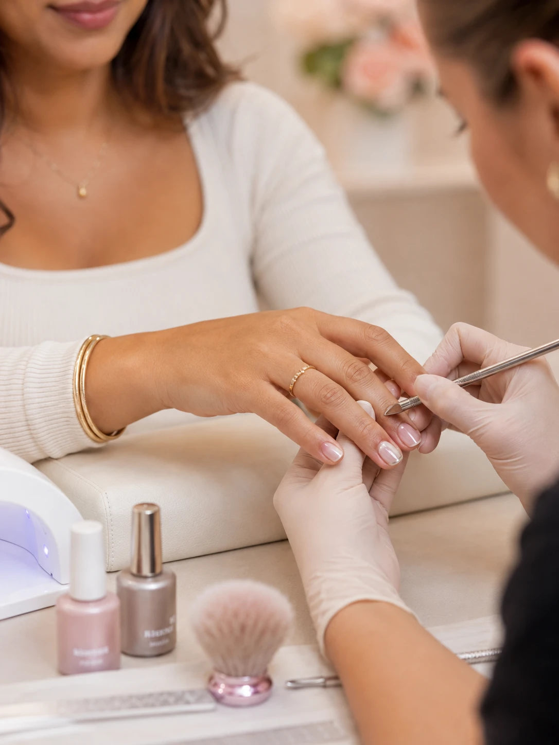 Professional manicure service with soft pink nails for a client near Breakfast Point
