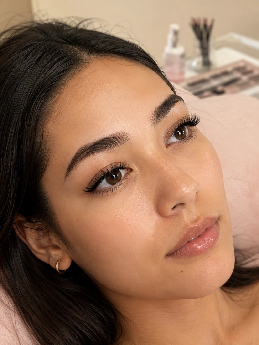 Close-up of soft volume eyelash extensions and groomed eyebrows on a female client near Ashfield