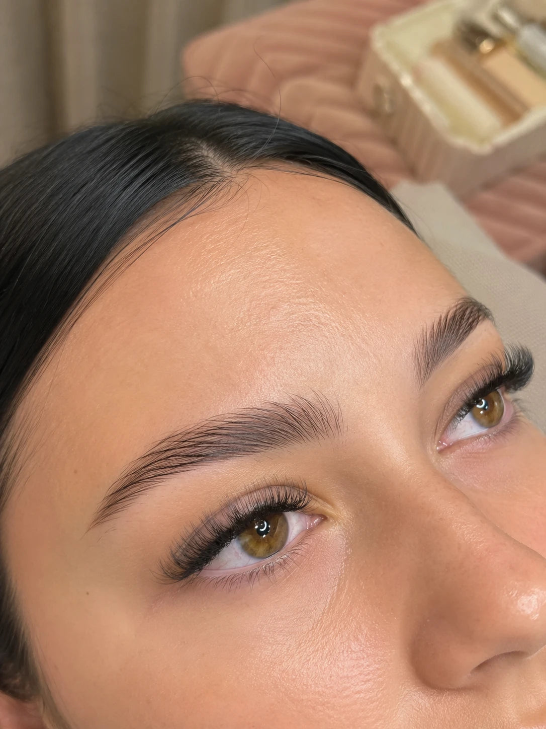 Close-up of soft volume eyelash extensions and groomed eyebrows on a female client near Croydon