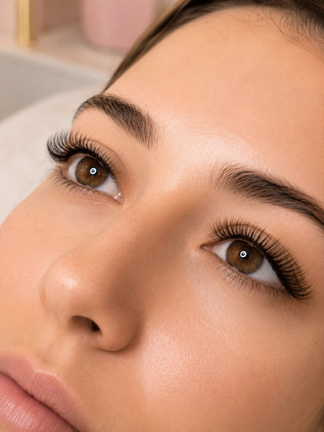 Close-up of full curled eyelash extensions and groomed eyebrows on a female client near Drummoyne