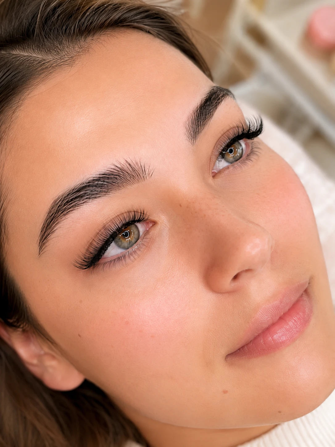 Close-up of soft volume eyelash extensions and groomed eyebrows on a female client near Drummoyne