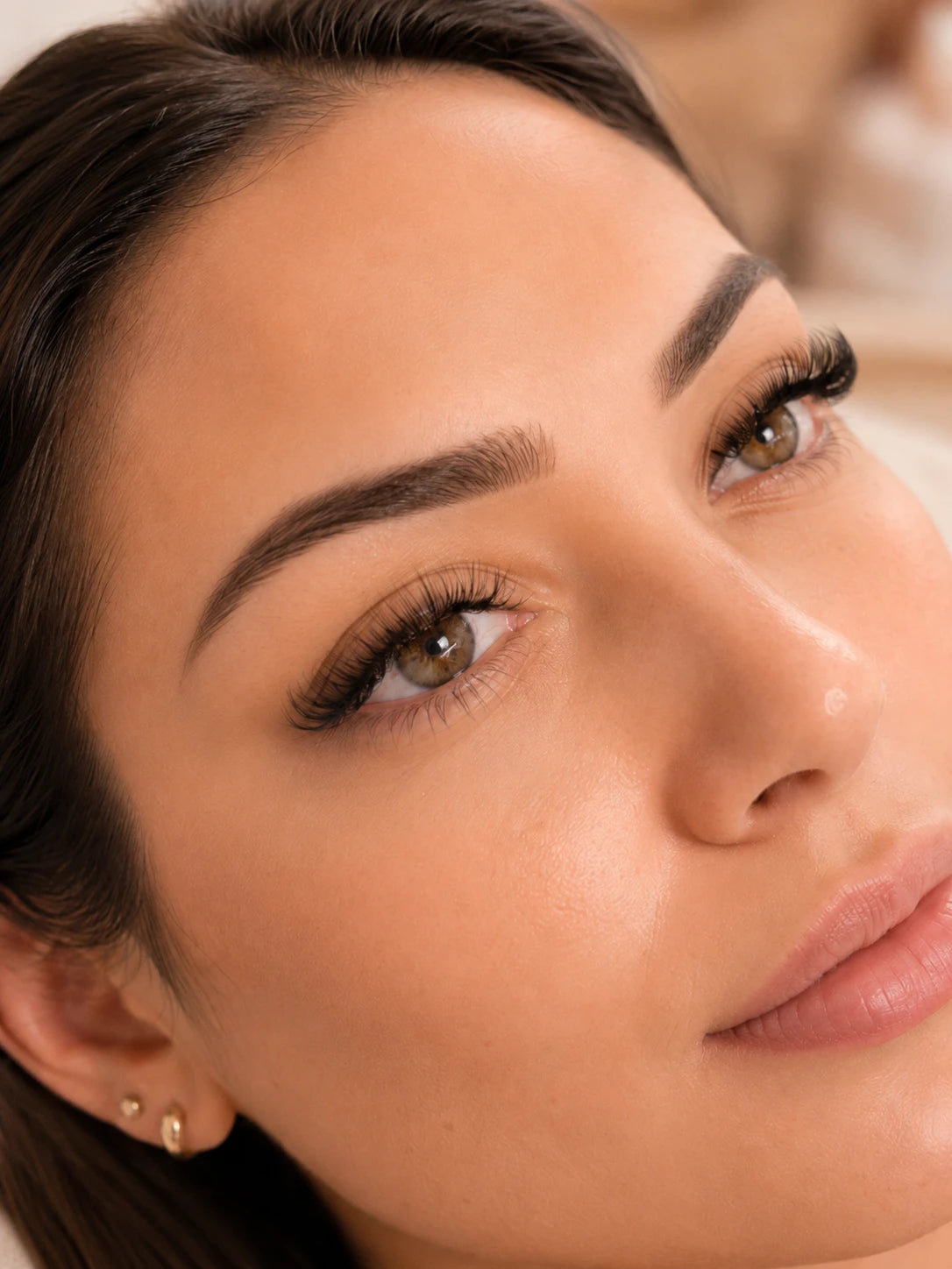 Close-up of soft volume eyelash extensions and groomed eyebrows on a female client near Five Dock