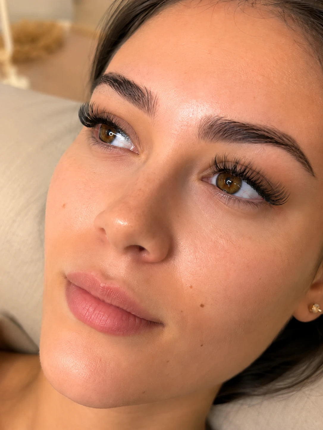Close-up of soft volume eyelash extensions and groomed eyebrows on a female client near Lane Cove