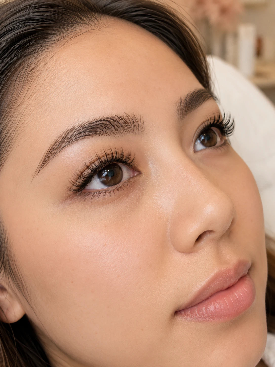 Close-up of natural eyelash extensions and softly defined brows on a female client near Macquarie Park