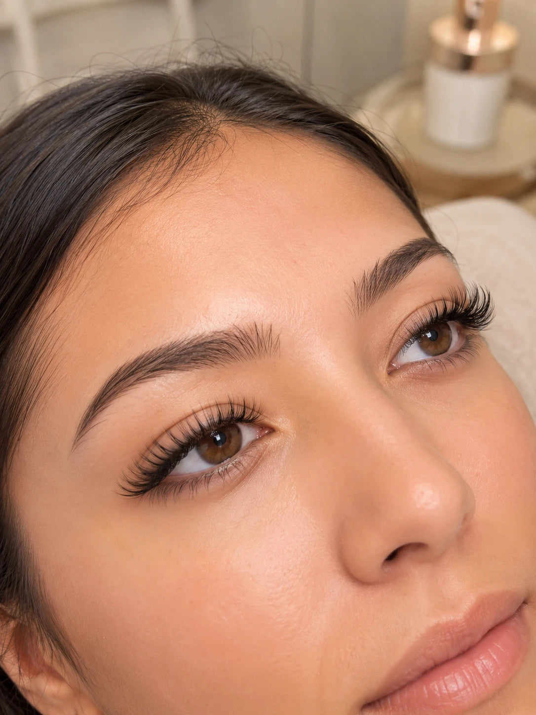 Close-up of soft volume eyelash extensions and groomed eyebrows on a female client near Ryde