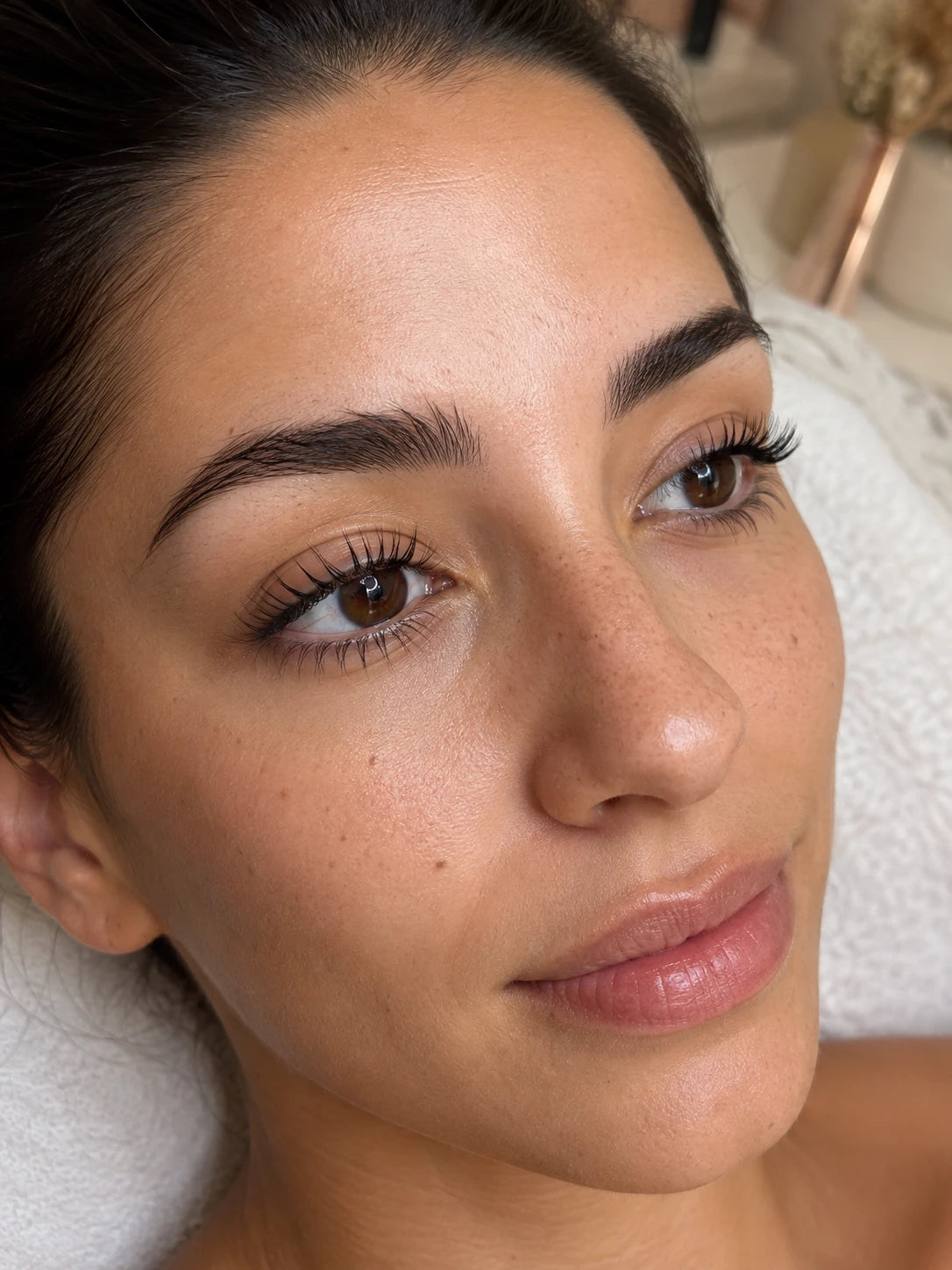 Close-up of defined natural lashes after a lash lift and groomed eyebrows near Abbotsford