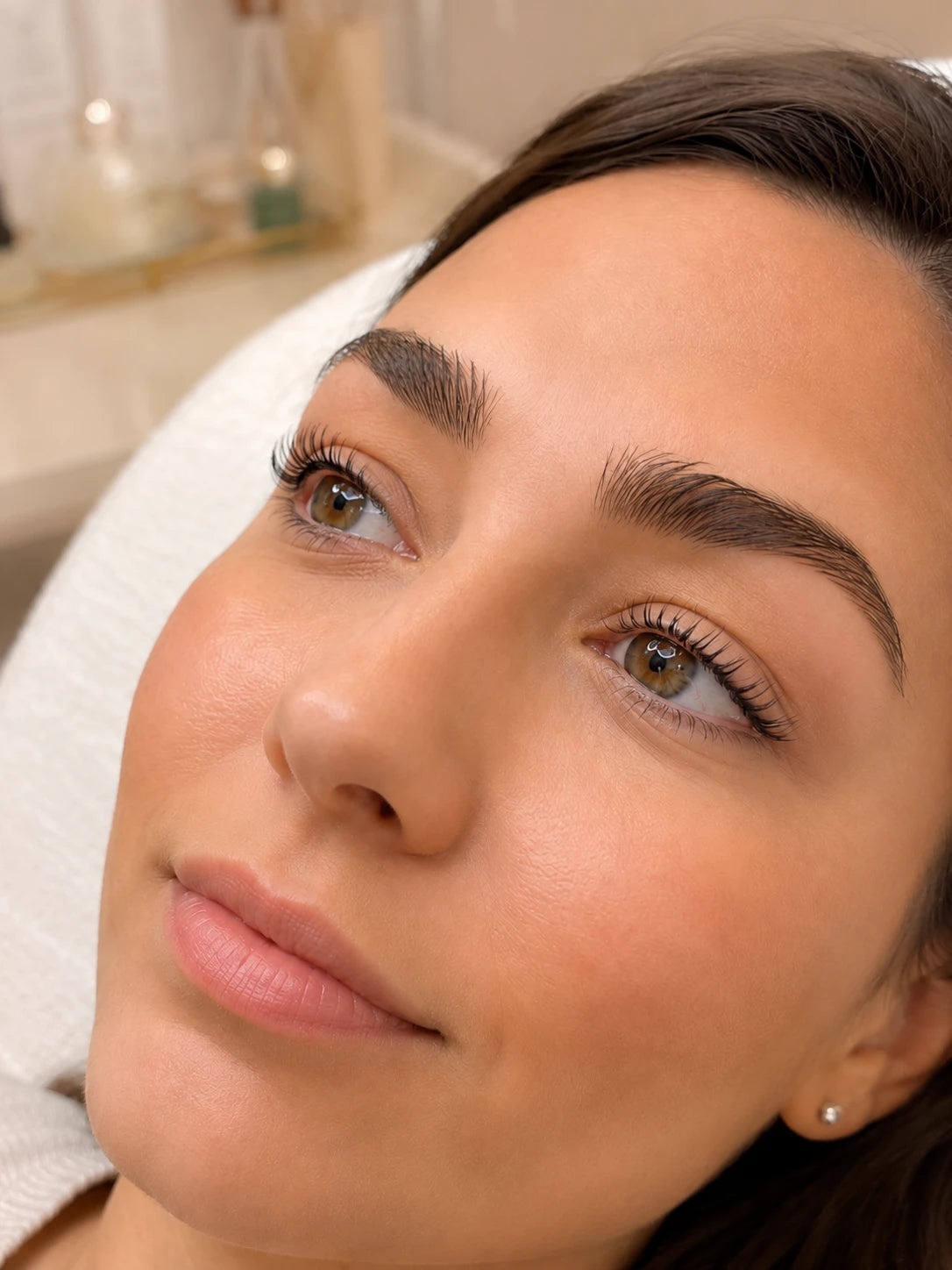 Close-up of natural lifted lashes and groomed eyebrows on a female client near Lane Cove