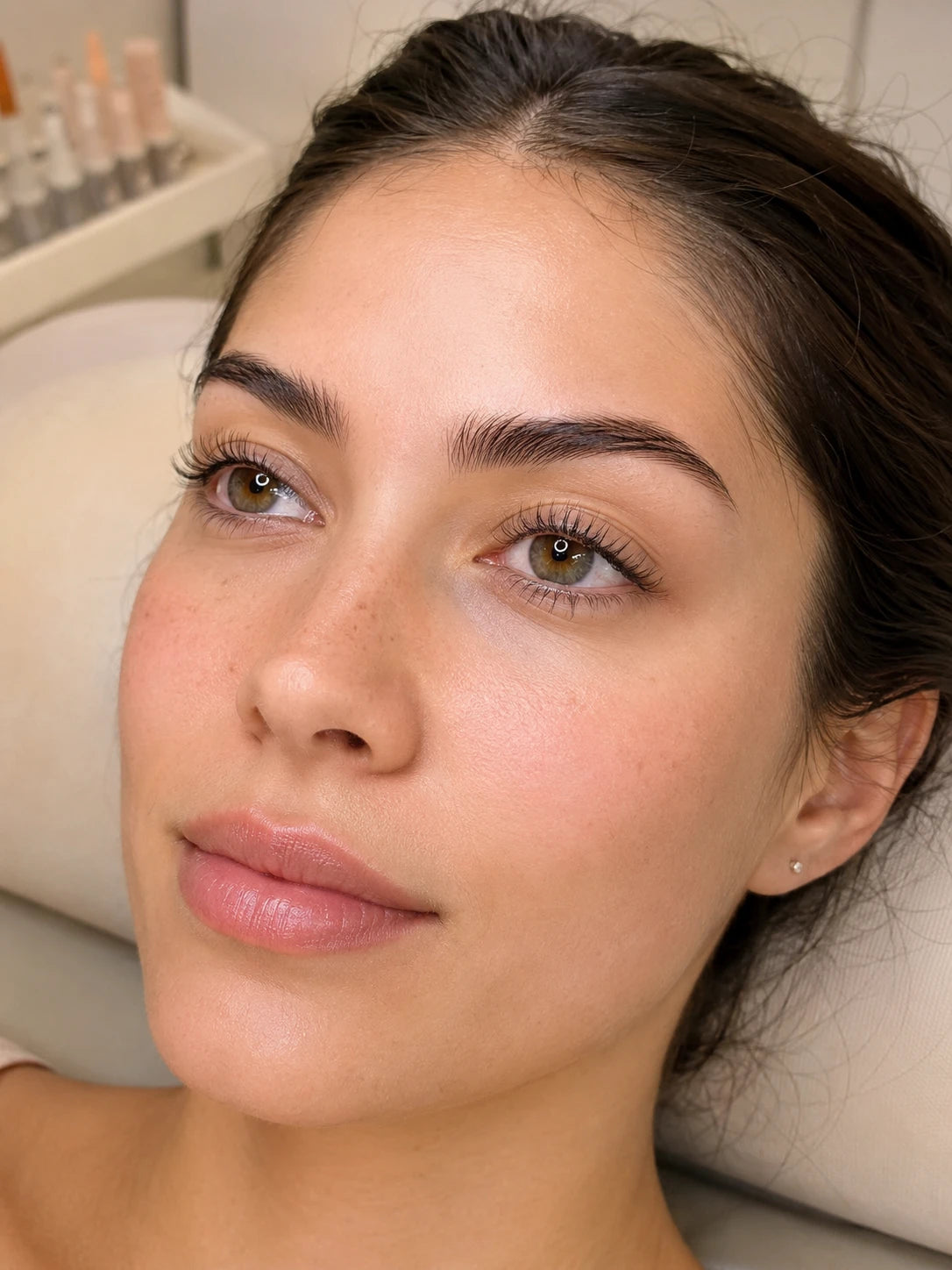 Close-up of a female client with a natural lash lift and groomed eyebrows near Putney